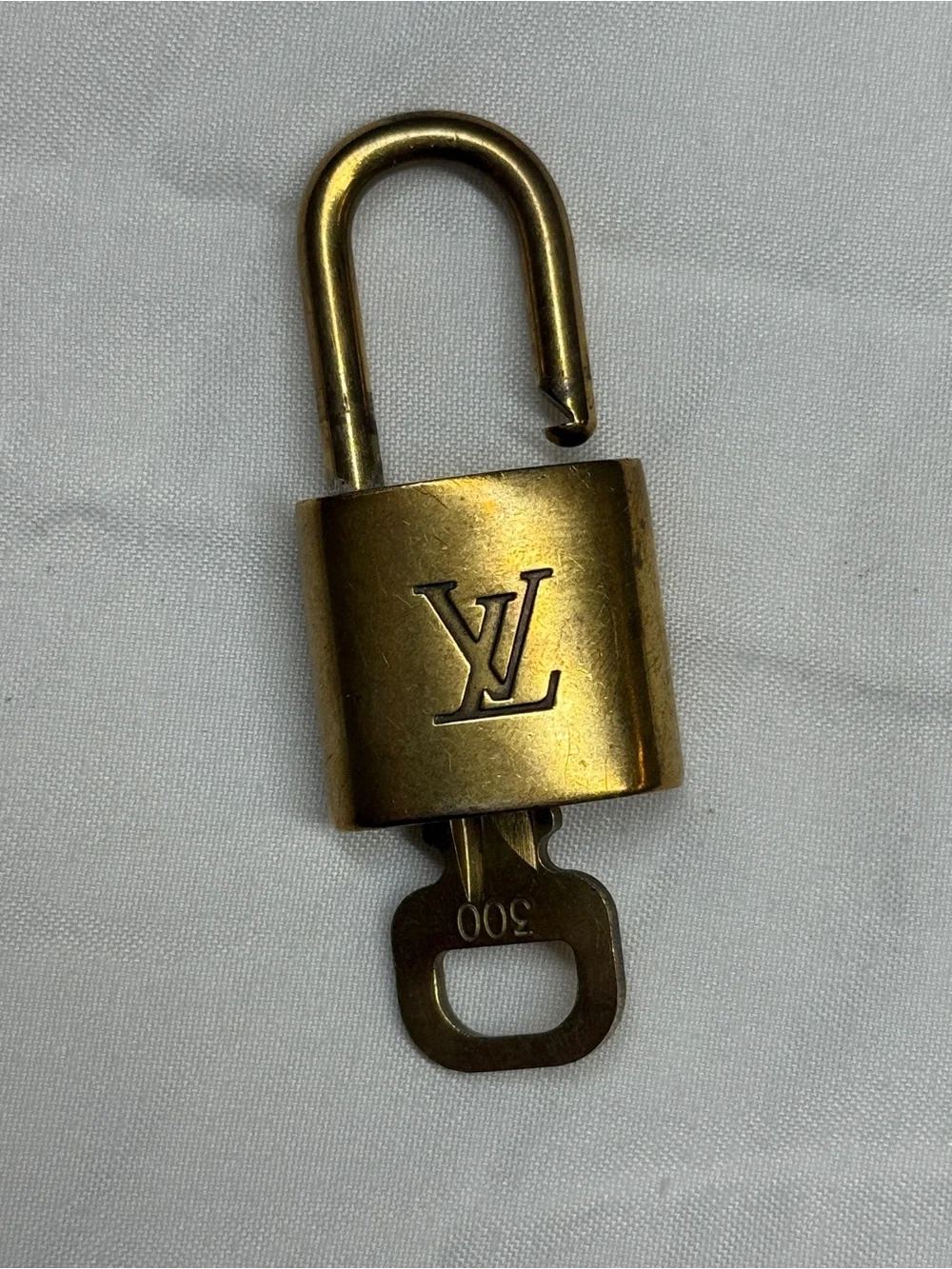 Louis Vuitton Gold Tone Monogram Padlock with Key # 300